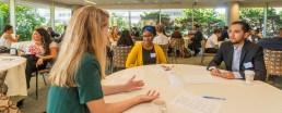 kelly with students networking breakfast