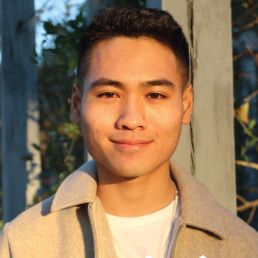 image of a smiling Teens in Print student, standing outside and sunlit
